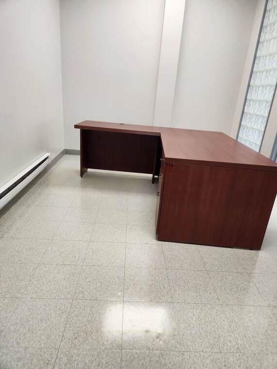 Refinished office floor reflecting the ceiling lights